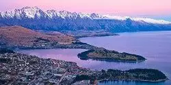 Image looking down on Queenstown and Lake Wakatipu from the top of the Skyline Gondola as dusk - mobile