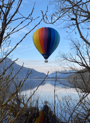 Image of a couple sitting in the back of their 4x4 rental car at dusk