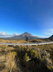 Image of two guys unloading their bags from the back of their rental car