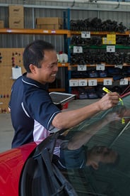 Image of a member of the GO Rentals Team preparing a rental car for a new customer