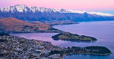 Image taken from the top of the Skyline Gondola looking down over Queenstown and Lake Wakatipu at dusk