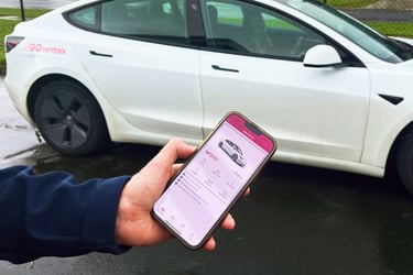 Image looking down on a female using the GO Rentals App to make a booking