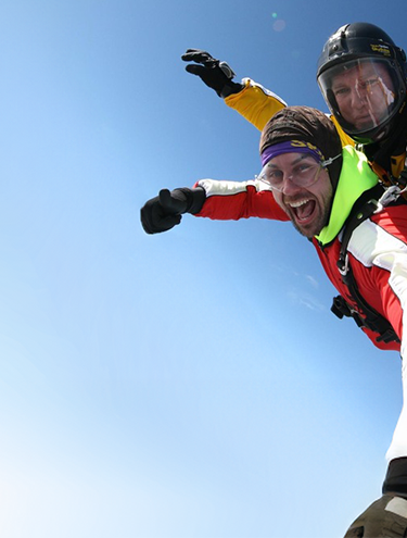 Image of two guys tandem skydiving 