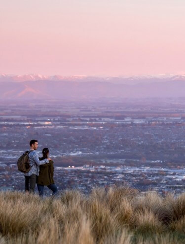 Image of Christchurch city taken from the Port Hills at dusk with the Southern Alps in the background