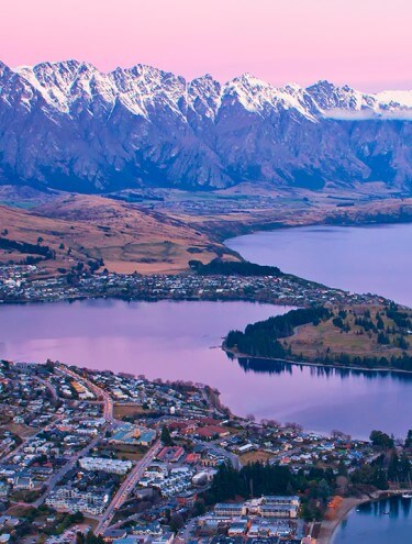 Image taken from the top of the Skyline Gondola looking down over Queenstown and Lake Wakatipu at dusk