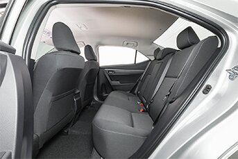 Interior rear image of a Toyota Corolla touring sedan showing the back seats