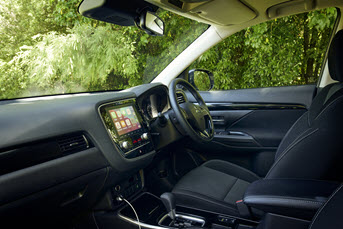 Interior front image of a Mitsubishi Outlander showing the dashboard and entertainment system