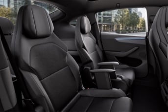 White Tesla Model Y L interior with black leather seats and spacious rear seating