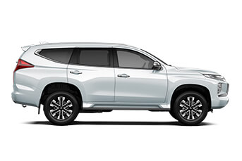 Rear image of a grey Hyundai Santa Fe SUV on a white background