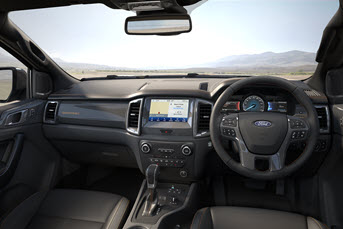 Interior image of the rear of a Toyota Hilux 4x4 showing the back seats