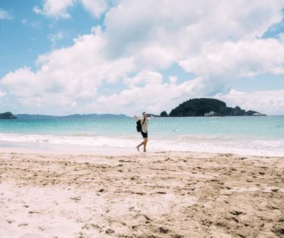 Mateusz walking in one of many New Zealand beaches