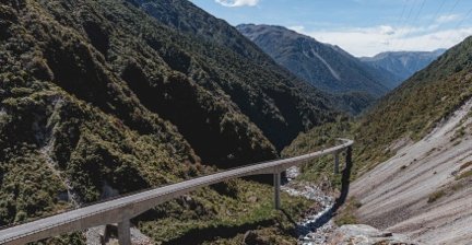 Bridge winding through the steep mountain valley of Arthur’s Pass