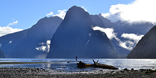 Image of Milford Sound with Mitre Peak in the background on a sunny day