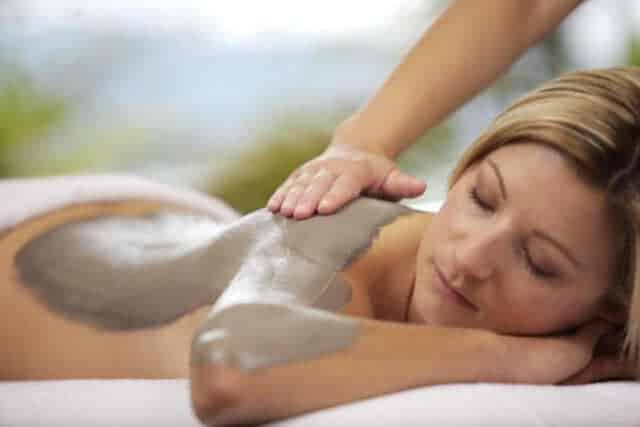 Image of a lady having a mud treatment at one of New Zealand's many luxury spas