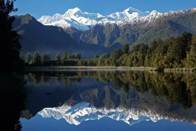 View of Mount Cook Aoraki reflected in the crystal clear waters of Lake Matheson