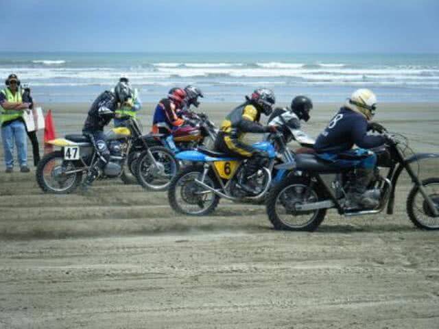 Image of motorcycles racing on the beach at the Burt Munro Challenge