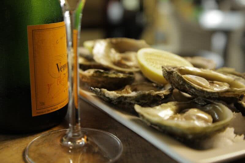 Image of Bluff oysters and a bottle and glass of champage