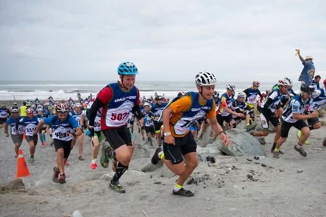 Competitors in the Kathmandu Coast to Coast on the start line at Kumara beach. Image credit: Marathon Photos