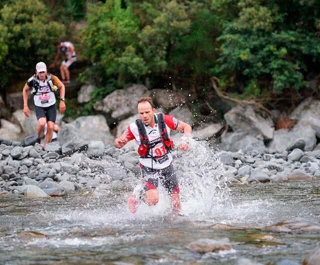 Competitors face a series of river crossings along the route. Image credit: Marathon Photos