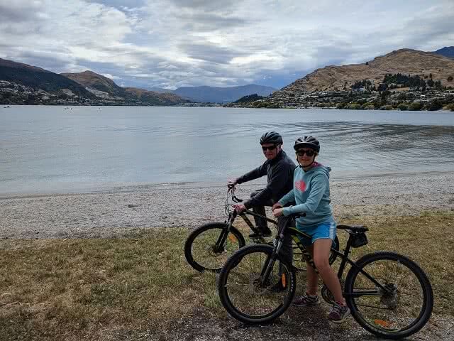 Image of two people cycling in Queenstown