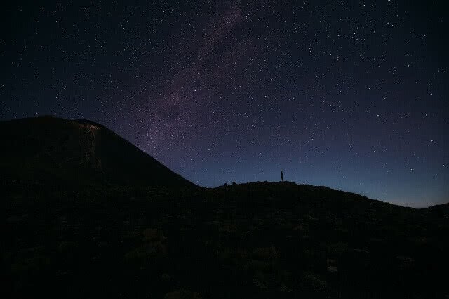 Hiking the Tongariro Crossing at night. Image credit: Kenrick Rhys