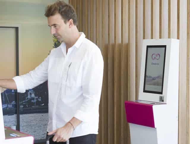 Man using Self Service Kiosks at GO Rentals