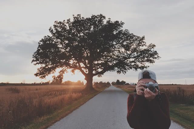 Man taking photo with DSLR