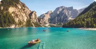 Image of rowing boats on crystal clear waters