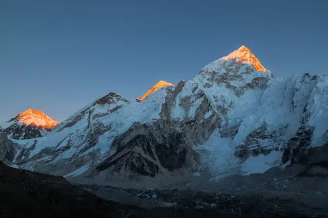 The sun rising over the snow-capped peaks of Mt Everest