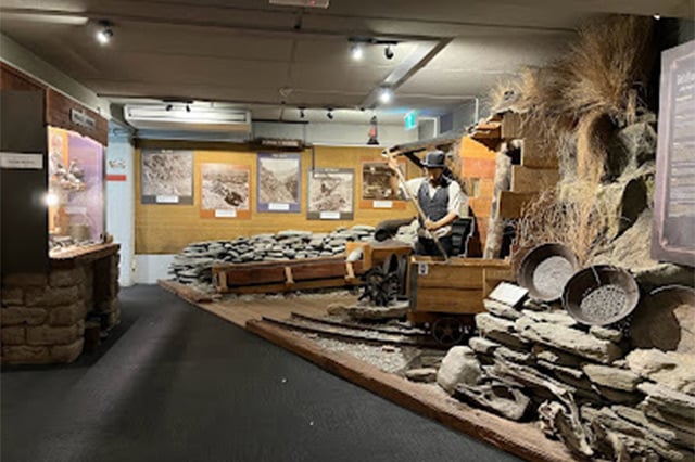 a display at the lake district museum in Arrowtown showing a mannequin mining