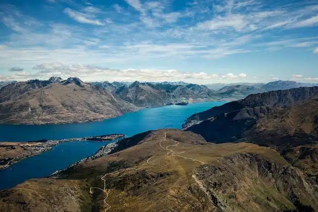 aerial view of the walking tracks on Queenstown Hill with a view of the lakes and mountains