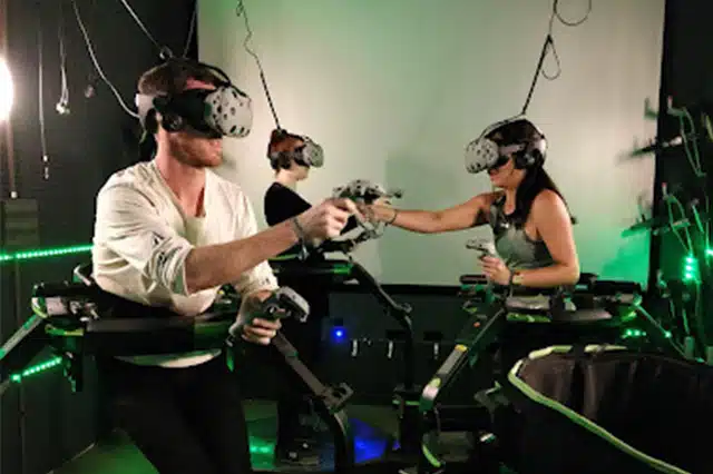 3 people using virtual reality equipment 